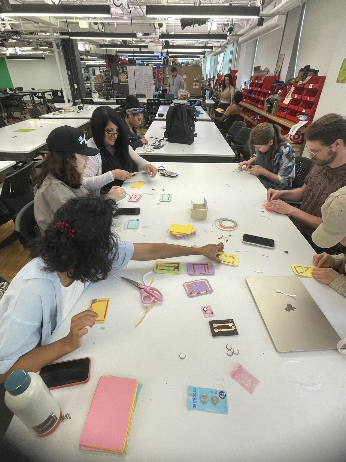 participants at the workshop assembling their circuits on craft foam